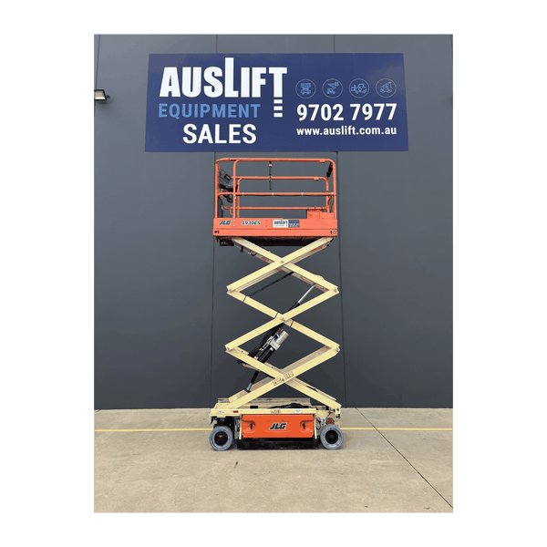 JLG 1930ES electric scissor lift (SN6420) platform raised, Auslift signage