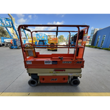 JLG 1930ES electric scissor lift (SN8095) right side view lowered position